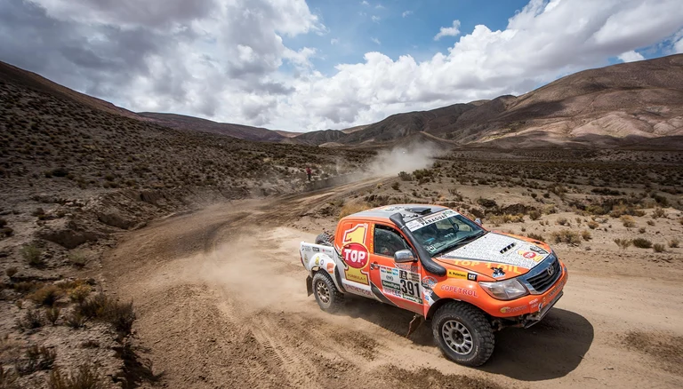 off-road vehicle in desert for dakar rally