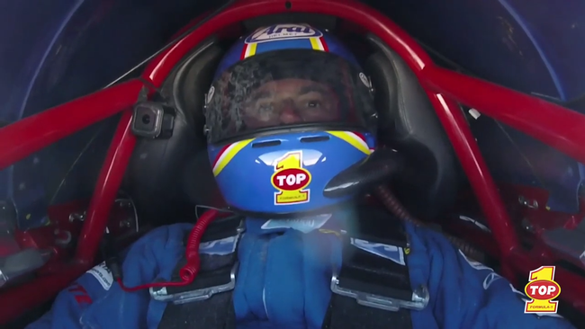 cockpit view of a racing driver powered by top 1 oil