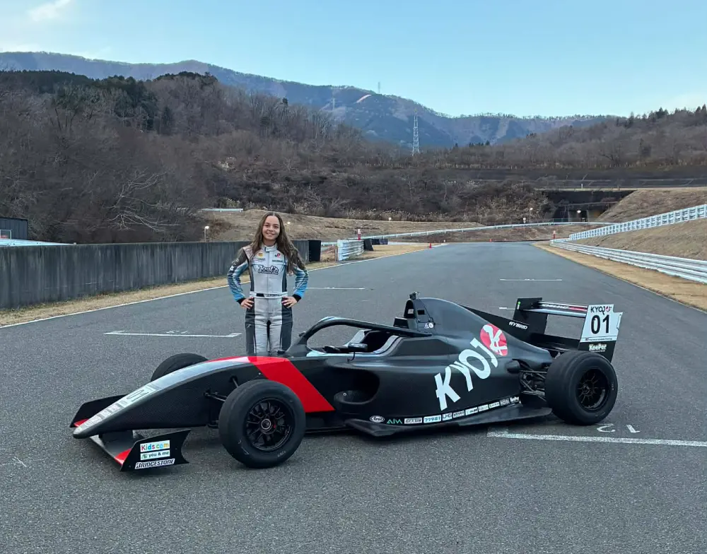 Woman racer Jure Portelli and her #01 KYOJ formula car ready to conquer the track.
